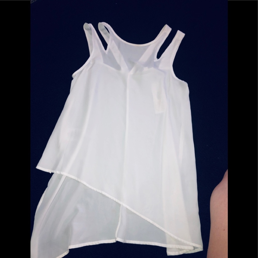 White blouse with tags.🔮
